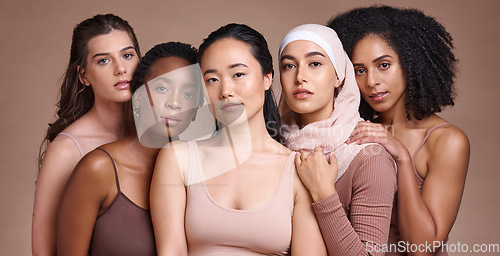 Image of Portrait, beauty and diversity with a model woman group in studio on a brown background for inclusion. Face, natural and different with a female and friends posing to promote health or equality