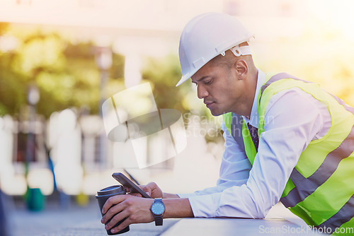 Image of Construction engineer, man and coffee with phone for typing, reading notification or architect management in city. Industrial contractor, smartphone and coffee break for online mobile tech connection