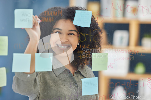 Image of Glass, sticky notes and woman writing idea, planning and strategy in office, happy and vision. Wall, black woman and creative notes by leader, goal and future innovation, mission and target plan