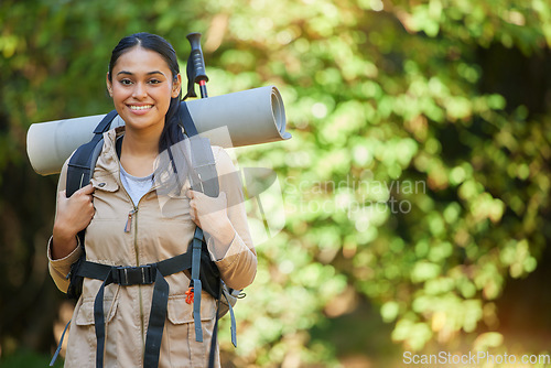 Image of Forest, woman or camper hiking in nature with a backpack with camping gear in a relaxing holiday vacation in New Zealand. Travel, portrait or happy girl hiker trekking or walking for healthy exercise