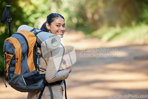 Image of Hiking, woman and portrait of a hiker in a forest for adventure backpacking in nature. Female backpacker, hike and exercise or fitness to explore natural environment while training in the woods