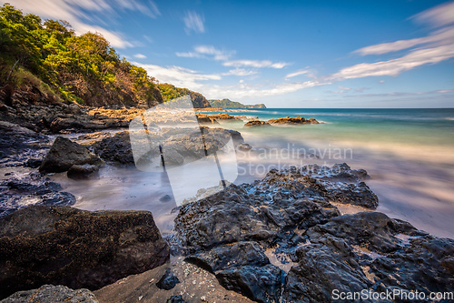 Image of Long exposure, pacific ocean waves on rock in Playa Ocotal, El Coco Costa Rica