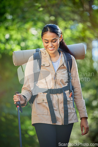 Image of Hiking, travel and woman with trekking pole for stability or mobility outdoors. Freedom, adventure or happy female hiker from India exercise or training with walking stick for tough terrain in nature