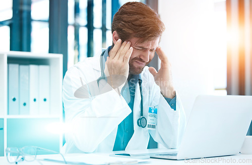 Image of Doctor, headache and hospital computer of a healthcare man worker with stress about life insurance. Health consulting, anxiety and burnout of a employee with a 404 and laptop glitch data problem