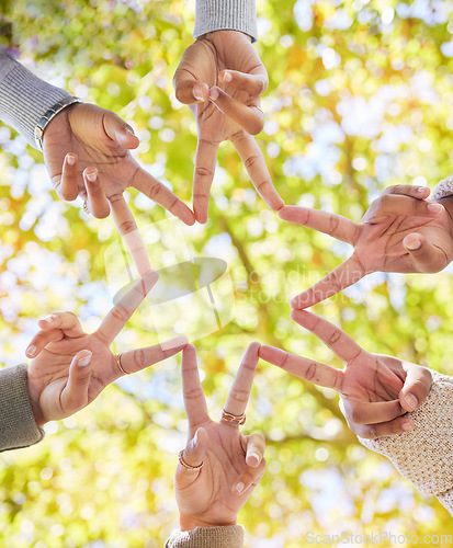 Image of Star, finger and group of people linked from below for support, community and collaboration with friendship. Friends, shape and hand gesture for connection and solidarity with teamwork and commitment