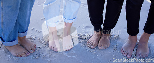 Image of Beach feet, friends and people on vacation, holiday or summer trip. Toes, freedom and group of men and women standing on sandy seashore, seaside or coast, having fun or enjoying quality time outdoors