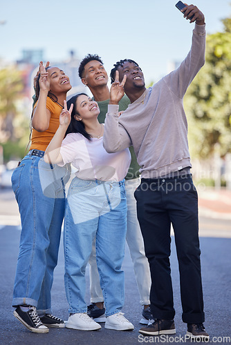 Image of Friends, selfie with peace, urban and group photography in street, smartphone and travel with youth in Washington DC. Phone, social media content and smile in picture, v hand sign and trip outdoor.