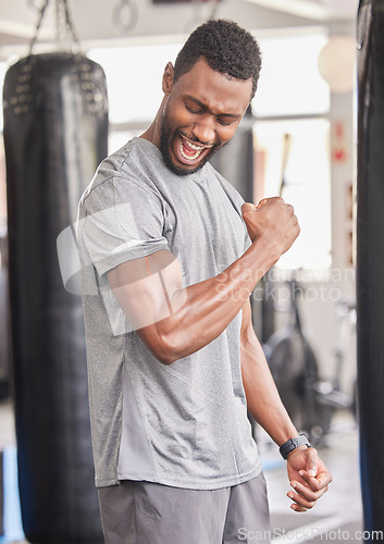 Image of Fitness, gym and excited black man with muscle after workout, bodybuilder training and boxing exercise. Sports, power and strong male athlete flex biceps for muscular body, goals and achievement