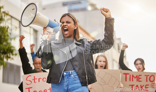 Image of Protest, shouting and woman with megaphone in city marching for gender equality, justice and freedom. Demonstration, social change and crowd of people for human rights, free speech and and revolution