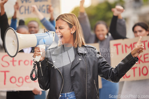 Image of Protest, demonstration and woman with megaphone in city shouting for justice, freedom and equality. Free speech, human rights and crowd of people marching for social change, revolution and politics