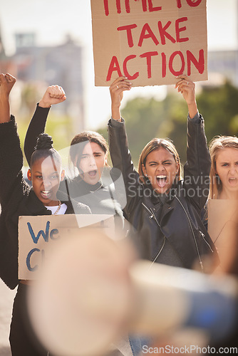 Image of Woman, protest and billboard of community in the city raising fists for equality, gender based violence or change. Women activist standing together in street march for strike, voice or action message