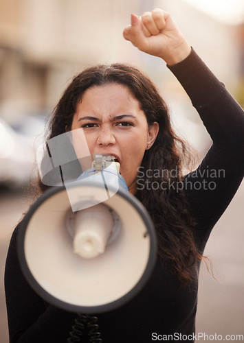 Image of Woman, face and megaphone for protest in city street for human rights, change empowerment and community equality. Gen z girl, angry and fight for government support, revolution and democracy in Iran