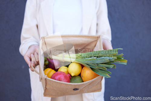 Image of Food, grocery and vegetables with hands of woman and bag for shopping, health and fruits from farmers market. Retail, sale and sustainability with girl customer and products for nutrition or diet