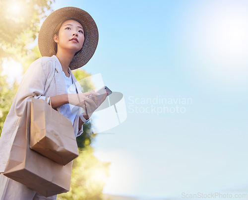 Image of Asian, woman with bags and shopping with smartphone mockup for internet deals, online sales and ecommerce promo outdoors. Japanese customer, retail and online shopping waiting for taxi with cellphone