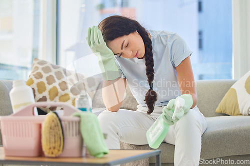 Image of Cleaner, stress and tired for spring cleaning apartment or housekeeping and burnout in living room. Overworked maid, exhausted and fatigue on sofa with hygiene chemicals for disinfection maintenance