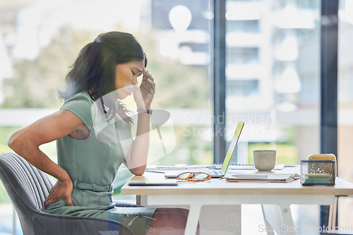 Image of Burnout, back pain or black woman with headache in office from depression, mental health or anxiety for work. Tired, mental health or sad employee frustrated, stress and laptop for finance tax audit