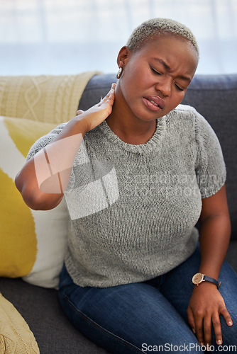 Image of Stress, neck pain and tired black woman on sofa with injury in living room of apartment. Burnout, muscle pain and anxiety, woman with headache from being overworked and exhausted on couch in home.