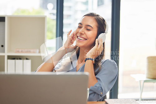 Image of Headphones, woman and office for stress relief, happy and music for break, listen and calm. Business, female employee and administrator with headset for songs, radio and podcast in workplace to relax