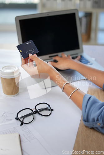 Image of Laptop, credit card and woman doing online shopping in office with sale, discount and promotion. Ecommerce, technology and lady paying her bills, debt or purchase with internet banking and technology