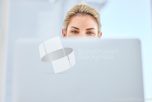 Image of Woman, laptop and office for reading, research or focus with eyes, IT or information technology. Mobile computer girl, iot and data analytics on internet, web and cybersecurity with vision in Sweden