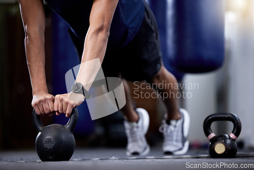 Image of Exercise, kettlebell and strong hands man doing gym workout with a fitness watch during muscle training as bodybuilder with metal weights. Athlete with smartwatch to train for power and health goals