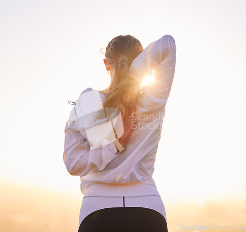 Image of Fitness, stretching and woman exercise at sunset for training, wellness and running in nature, rear view and body preparation. Sports, stretch and girl runner getting ready for workout at sunrise