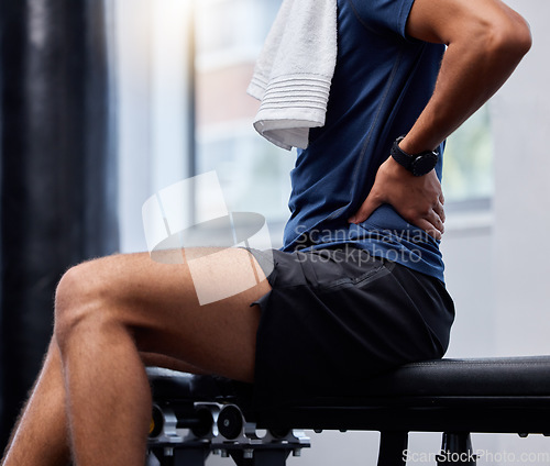 Image of Back pain, fitness and man at gym for training, health and workout while suffering injury, arthritis and sport injury from weightlifting. Backache, exercise and guy at sports center with inflammation