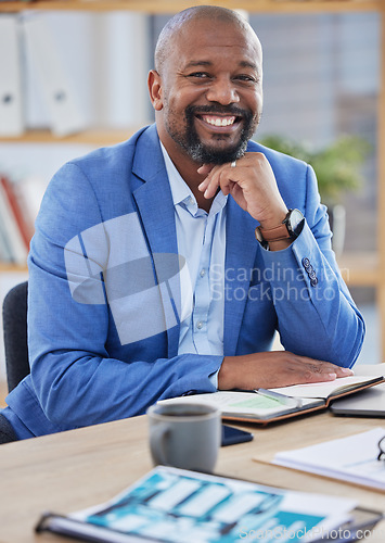 Image of Happy black man, business manager and ceo working at modern office desk as financial investor, stock market trader and corporate worker in Nigeria. Portrait smile of african executive leader and boss