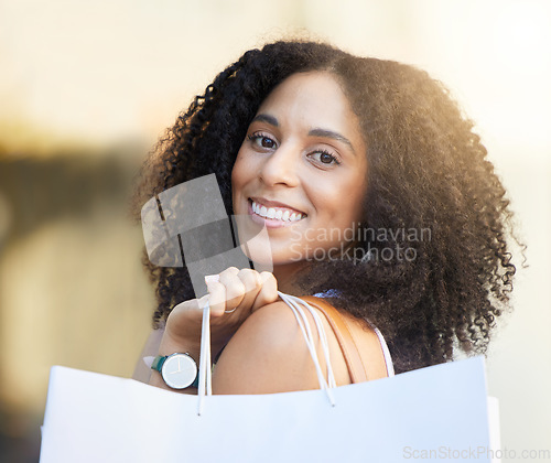 Image of Fashion woman, face or shopping bags in urban city in Brazilian retail therapy, clothes sales or clothing boutique promotion. Portrait, smile or happy customer with gifts, trendy or curly hair style