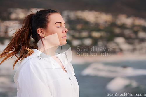 Image of Woman, beach and relax meditation or thinking with closed eyes for calm mental health, freedom travel and mindfulness. Peace, ocean sunshine and relaxing mindset on traveling vacation in Cape Town