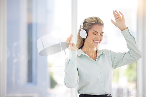 Image of Business woman, headphones and dance in office, relax or celebrate success. Female entrepreneur, ceo and lady with earphones for music, audio or radio for stress relief, dancing or smile in workplace