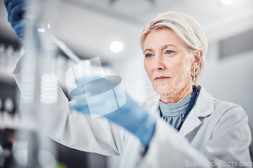 Image of Senior woman, science beaker and pipette in laboratory for medical research. Scientist, innovation and elderly female doctor experimenting, analysis or testing and researching virus cure with dropper