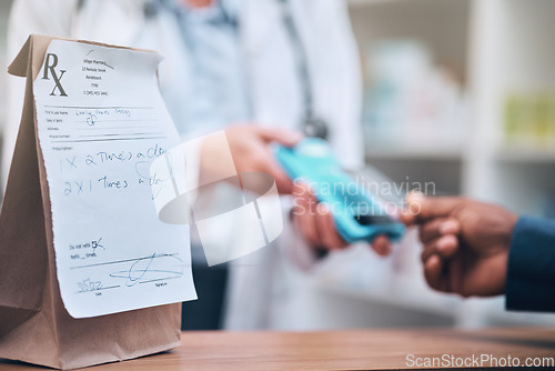 Image of Pharmacy, card machine and patient paying for the medication at medical clinic dispensary. Credit card, prescription medicine and closeup of payment with cash dispenser point at pharmaceutical store.