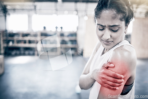 Image of Woman, fitness and shoulder pain in gym for exercise workout, training accident and sports medical emergency. Sad athlete, arm injury and physical therapy, arthritis or muscle wellness in health club