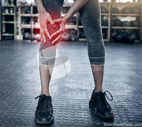 Image of Fitness, sports and injury, woman with knee pain at gym workout. Exercise, pain and girl with hand on leg for muscle massage, physical therapy for sports injury on knee and accident while training.