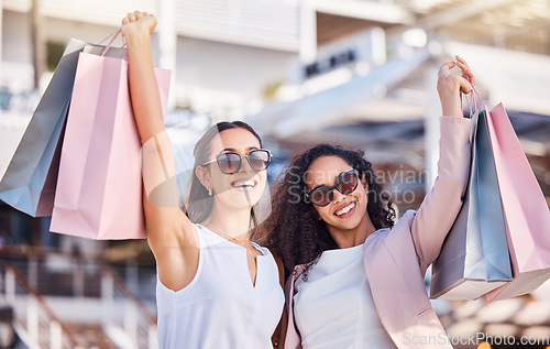 Image of Women, shopping and friends in city, bags or sale products for luxury boutique or purchase fashion. Females, girls or customers spending money, retail for spree or expensive clothes for clients