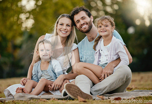 Image of Family, park picnic and portrait with smile, love and happiness for bonding on blanket, grass and sunshine. Young happy family, lawn and parents with kids, trees and relax together for summer holiday