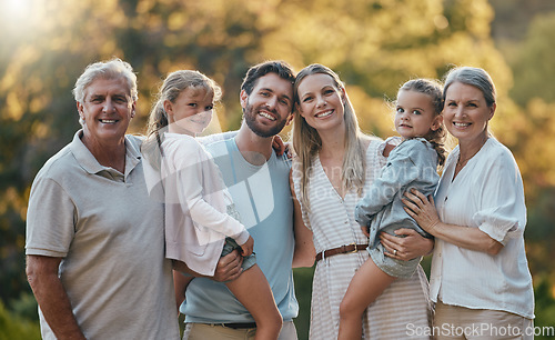 Image of Love, family and grandparents with girls, parents and smile together for bonding, loving in park. Portrait, grandmother and grandfather with mother, father and daughters for vacation and outdoor.