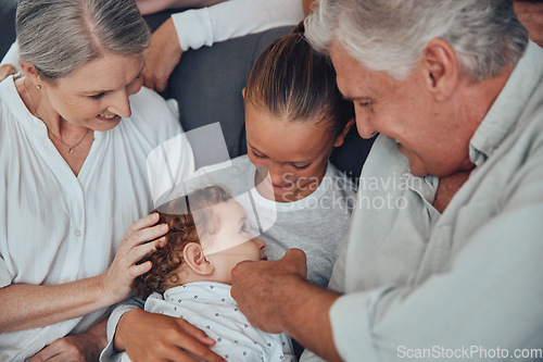 Image of Big family, baby and relax on sofa together in living room for love, support and children care. Grandparents, big sister and kid smile for happiness, quality time and bonding on couch in family home