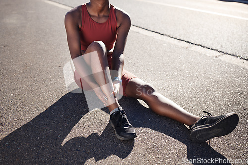 Image of Black woman, fitness and ankle pain, injury and outdoor accident, emergency and first aid risk in city street. Joint pain, bone health and foot trauma of athlete, sports wound and exercise problem