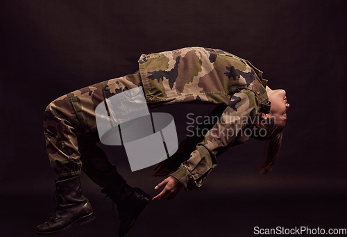 Image of Military soldier, army woman and depression on a dark studio background for mental health, stress and anxiety problem for trauma. Female in camouflage clothes for art deco of PTSD and psychology