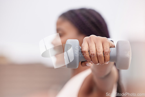 Image of Fitness, sports or black woman with dumbbell for strong arms, bicep muscles or powerful shoulders in training. Outdoors, blurry or African girl hands weightlifting in a workout or exercise in Nigeria