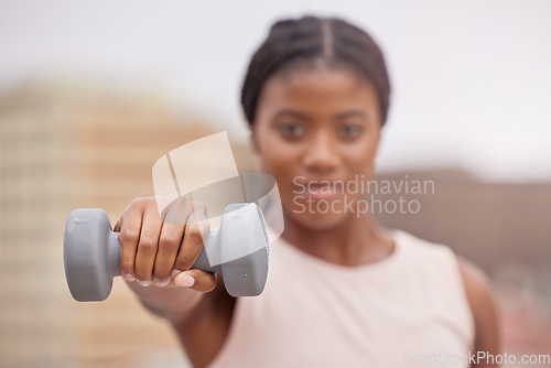 Image of Fitness, dumbbell or black woman in a city training, workout or arm exercise for strong muscles or growth. Blurry, motivation or healthy African girl exercising for body development on a rooftop