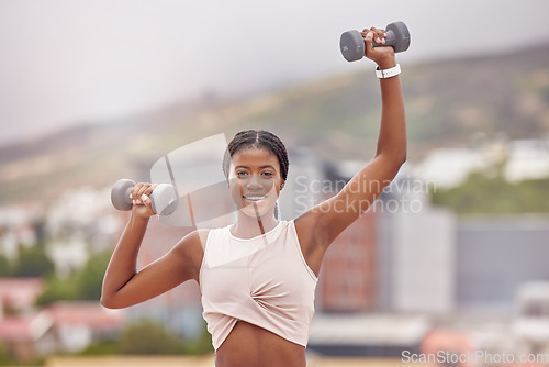 Image of Fitness, portrait and woman weightlifting with dumbells for bodybuilding and strong arms. Face, front and african american female bodybuilder exercising or training for strength in the city