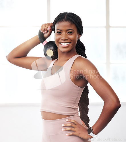 Image of Black woman, kettlebell portrait and smile for fitness, health and vision for strong body, focus and goals. Gym girl, bodybuilder training and happy for workout, exercise and self care in Atlanta