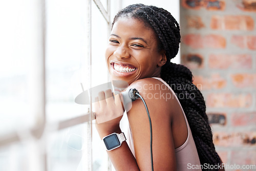 Image of Black woman, window and happy with fitness, exercise and wellness in gym, healthy active lifestyle and training in workout studio. Happiness, African athlete portrait with sports motivation mockup.