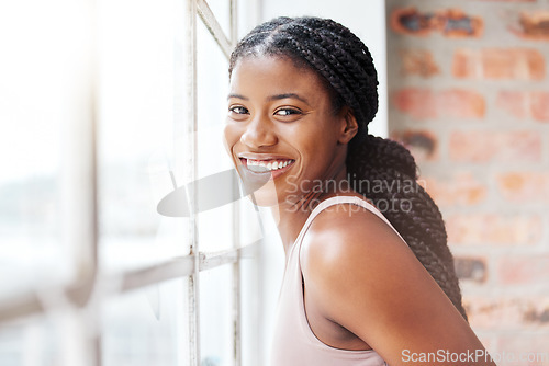 Image of Face portrait, black woman and smile in gym by window after workout, training or exercise. Sports, wellness or happy female athlete from Nigeria in fitness center on break after exercising for health