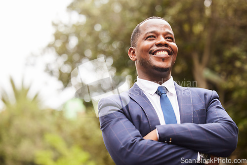 Image of Business, black man and leader crossed arms, outdoor and thinking for startup company. Young male Jamaican, entrepreneur and ceo with leadership, management and vision for success, relax or in nature