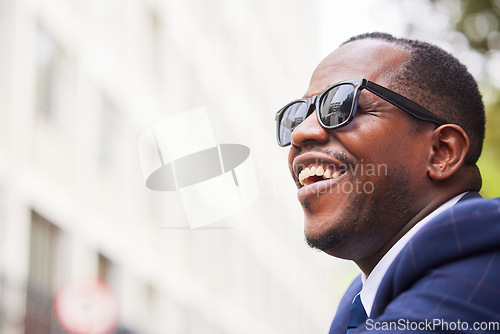 Image of Black man, face and glasses happy in city for business travel, work commute or walking in street. African american businessman, smile and walk with sunglasses in urban town or New York traveller