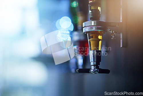 Image of Alcohol, drink and closeup of tap in nightclub for cocktail shots, pour alcoholic beverage and beer. Bartending, liquor and focus on beer tap for clubbing, restaurant and cocktail bar in background